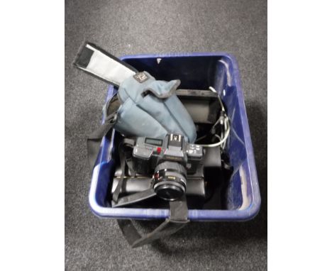 A box containing Yashica camera in bag, cased Cine camera, cased light meter and viewer