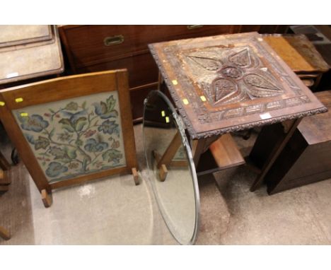 A CARVED OCCASIONAL TABLE TOGETHER WITH AN OVAL MIRROR AND A FIRESCREEN