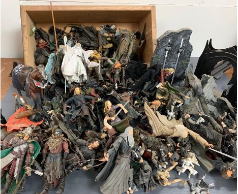 A large bundle of Lord of the Rings action figures, weapons and accessories 