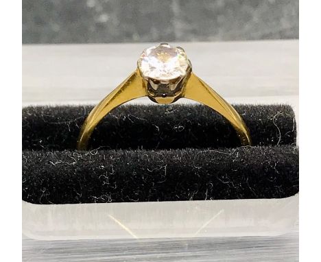 A Diamond Solitaire ring on an 18 ct yellow gold and platinum setting