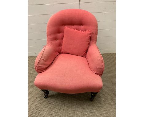 Pink upholstered bedroom chair with button and turn legs 