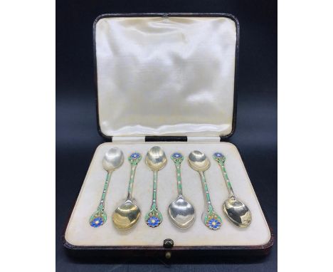 A Boxed set of six silver and enamel teaspoons, Birmingham hallmark 1935