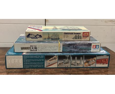 A selection of three model kits to include Revell Light Cruiser, Tamiya Battle Ship Yamato and Imai Christian Radich 
