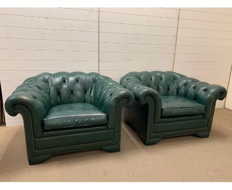 Green leather Chesterfield suite comprising of two armchairs and a sofa (chair W110cm H68cm D90cm sofa W216cm)