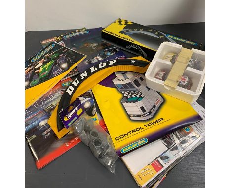 Scalextric accessories including Goodyear bridge, Dunlop bridge and magazines and two cars 