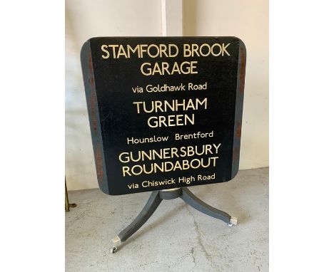 Tilt top table decorated with vintage London bus sign (H90cm W70cmsq)