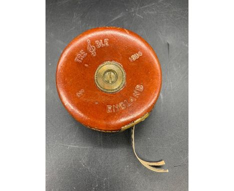 Vintage tape measure in a leather case