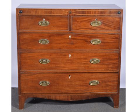A George IV mahogany chest of drawers, with stringing, banding and cross-banding, fitted with two short and three long drawer