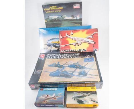 Four large boxes of aircraft model plastic kits, many still wrapped in plastic, to include models by Revell, Ertl, Airfix, He