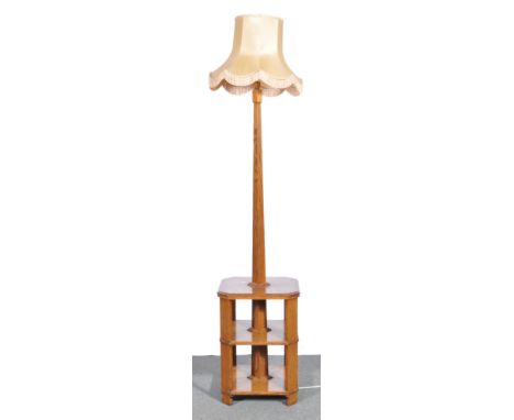 1940s oak standard lamp, with bookrack under, height 160cm.