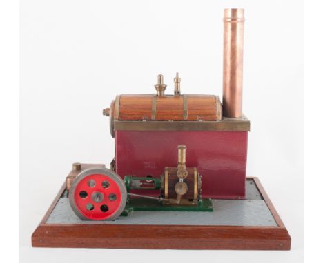 A model spirit fired beam engine, on a platform base.