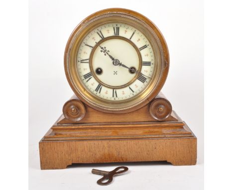 A Victorian golden oak mantle clock, drum case with moulded plinth, ivorine dial, German fourteen day movement, striking on a