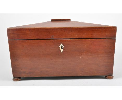 A Victorian walnut sarcophagus form tea caddy, fitted interior, raised on bun feet, width 37cm. 
