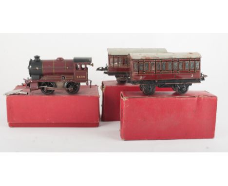 Collection of Hornby O gauge railway stock, including model 501 clockwork loco, other rolling stock, accessories and track. (