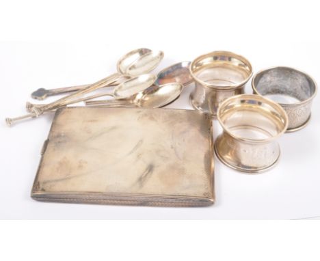 A silver cigarette case, Birmingham 1947, engine turned decoration, 10cm; six silver spoons and three silver napkin rings.