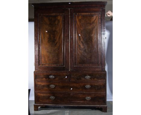 Victorian mahogany linen press, moulded cornice above a plain frieze, two panelled doors enclosing  later adapted hanging rai
