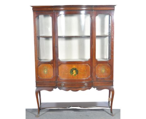 Victorian mahogany bow-front china cabinet, painted panels with urns of flowers and portrait, cabriole legs, joined by a serp