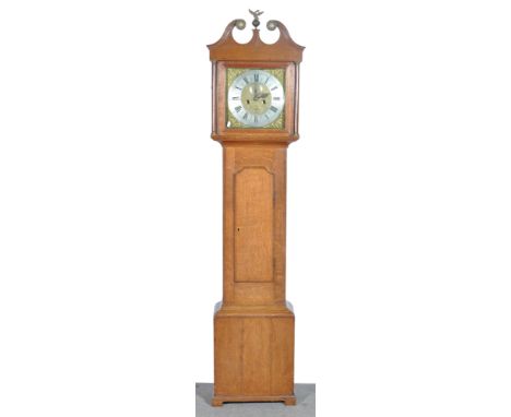 Oak longcase clock with a swan neck pediment, long door, bracket feet, twelve inch square brass dial with cast spandrels, sil