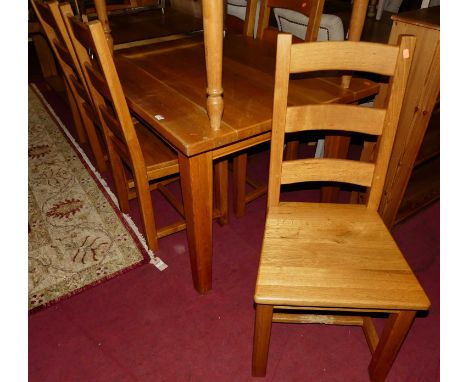 A contemporary light oak dining suite comprising; rectangular dining table on square slightly tapering supports, length 180cm