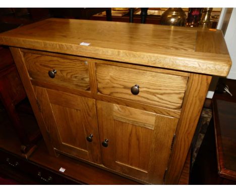 A contemporary small light oak double door side cupboard, with twin upper drawers, w.84cmCondition report: Width 84cm, height