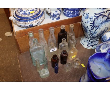 A collection of various vintage glass bottles 