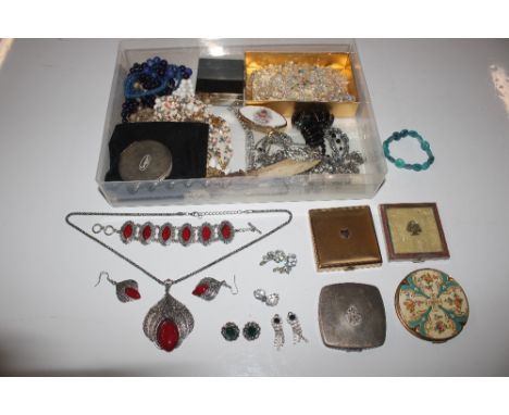 A box of vintage compacts and jewellery 