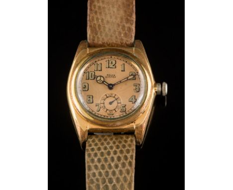 Rolex. A boy's size 1930's gold plated and stainless steel 'Rolex Oyster' wristwatch: the circular gold colour dial 24mm diam