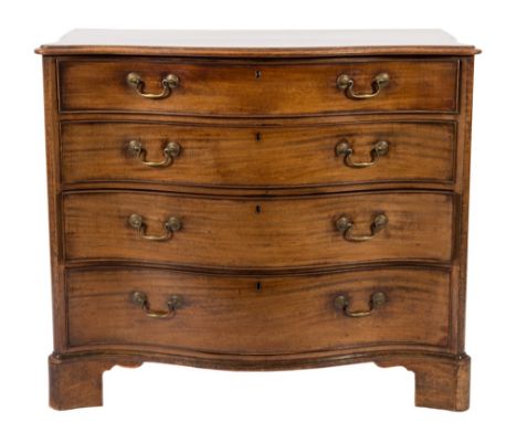 A George III mahogany serpentine fronted chest:, the top with a moulded edge, containing four long graduated drawers, between