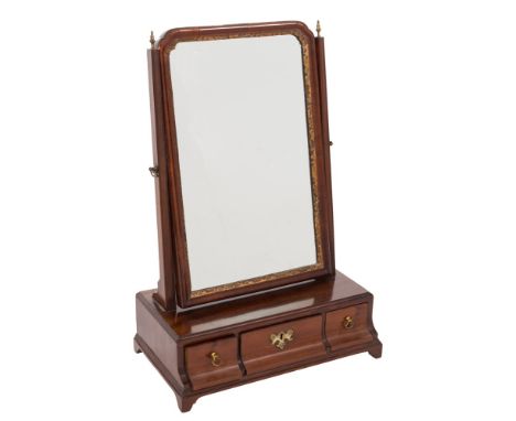 A George III mahogany swing frame platform toilet mirror:,  the rectangular plate within a gilt foliate slip and moulded surr