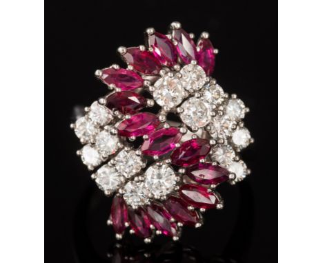 A ruby and diamond ballerina cluster ring: with fifteen marquise-shaped rubies and seventeen brilliant-cut diamonds estimated