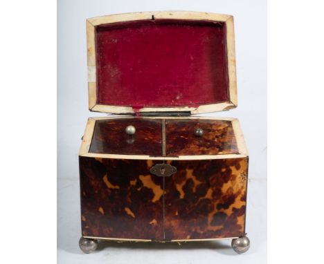 A 19th century blonde tortoiseshell  tea caddy : of rectangular outline, the shallow domed hinged lid enclosing two lidded co