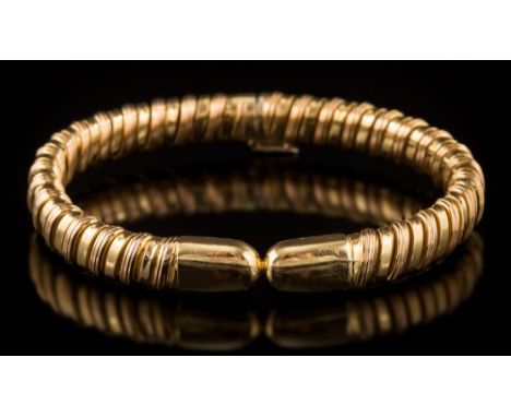 Boucheron. A two-colour 'gas-pipe' link bracelet: inscribed 'Boucheron 91004', the clasp stamped '750'.