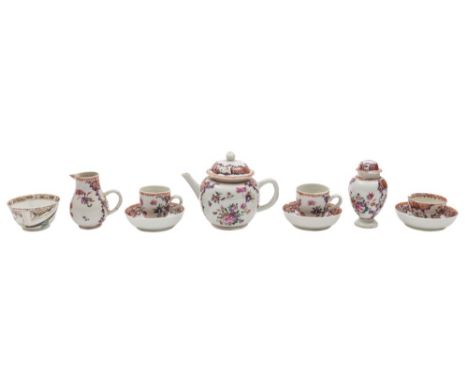 A Chinese famille rose miniature part tea service: painted in predominantly puce, pink and iron red enamels with floral spray