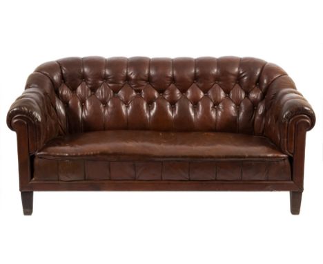 A Swedish Chesterfield style sofa:, fully upholstered in brown buttoned leather, on square tapered legs, 188cm (6ft 2in) long