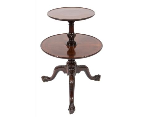 A mid 18th Century carved mahogany circular two tier graduated dumb waiter:, the dished tops on ring turned and spirally flut