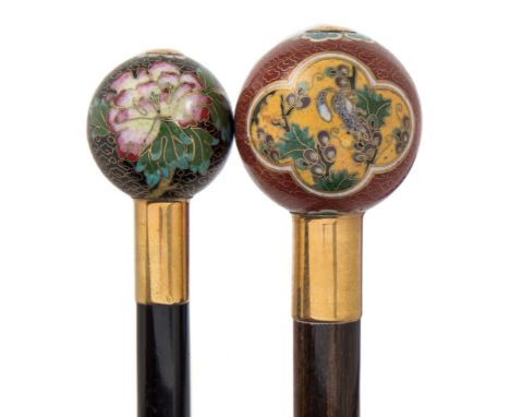 A 20th century ebonised walking stick: with cloisonne enamel ball handle decorated with flowers, 92cm. long together with a s