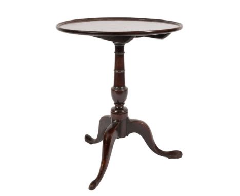 A George III mahogany circular occasional table:, with a dished snap top on ring turned vase knopped column and tripod splaye