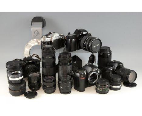 Collection of Nikon and Cannon cameras, Cannon prime lenses and a boxed Ray Flash Ring,.  We cannot guarantee the working ord