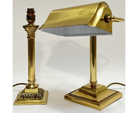 A brass desk lamp modelled as a fluted Corinthian column (h- 32cm), together with a brass banker's lamp (h- 33.5cm, w- 26cm) 