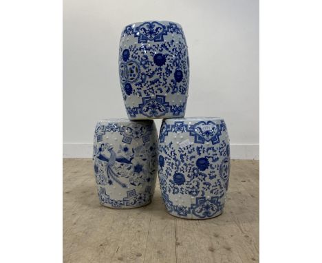 A pair of Chinese style blue and white ceramic veranda stools (H48cm) together with another similar (H46cm)