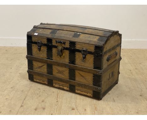 A 19th century pony skin covered and metal bound dome top seamer trunk with leather carry handle to each end and tray to inte