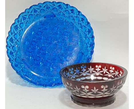 A blue pressed glass dish with geometric design (w- 28cm), together with a flashed ruby glass bowl (2)