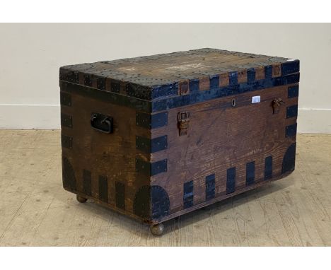 A 19th century metal bound pine travelling trunk, the lid, opening to reveal a tin lined interior baring a manufacturers pape
