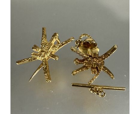 A Omani yellow metal button hole pin with chain and T bat and a matching lapel pin both with crossed sabers and Khanjar, ( H 