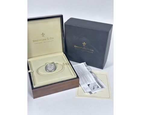 A Dreyfuss &amp; Co of Switzerland plated open face pocket watch with mechanical wind, silvered dial with subsidiaries dial c