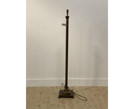 A patinated brass standard lamp formed as a Corinthian column H137cm