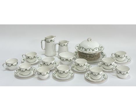 A Bisto England green ribbon and gilt pattern part tea service comprising a milk jug (h-14cm), a creamer jug, eleven teacups,