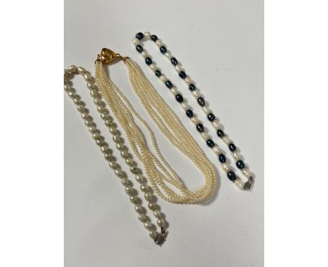 A fresh water silver baroque pearl necklace, (L x 20cm ), a fresh water baroque white and blue/ black alternating pearl neckl