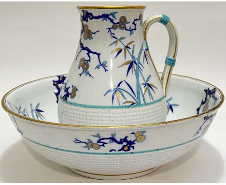 A Minton Aesthetic Movement jug and basin with Eastern inspired design in the manner of Christopher Dresser of bamboo and pru