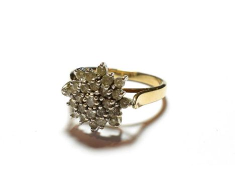 A 9 carat gold diamond cluster ring, finger size S.  Gross weight 4.9 grams. 